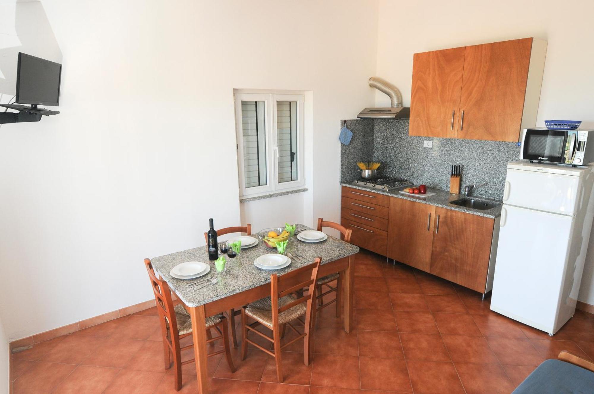 Gf Apartments Li Seddi Badesi Exterior foto